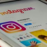 Instagram app listing on a tablet's App Store, showing the logo, 4.7-star rating, and a GET button