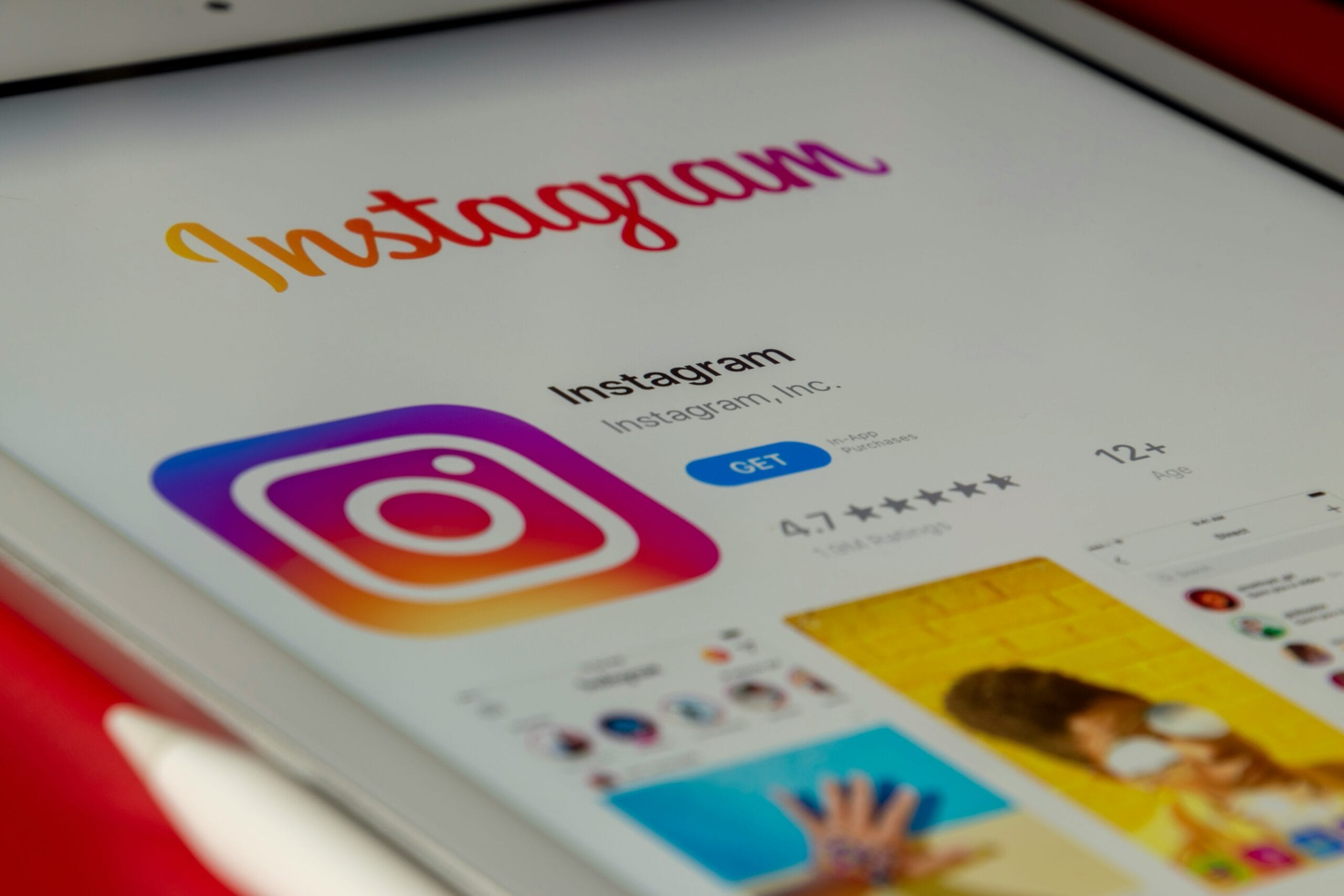 Instagram app listing on a tablet's App Store, showing the logo, 4.7-star rating, and a GET button
