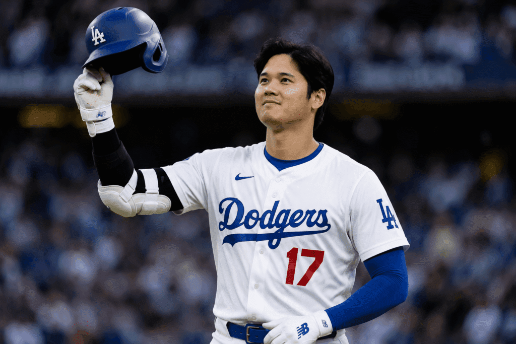 Shohei Ohtani tipping his helmet to the Dodger Stadium crowd while wearing his number 17 Dodgers uniform